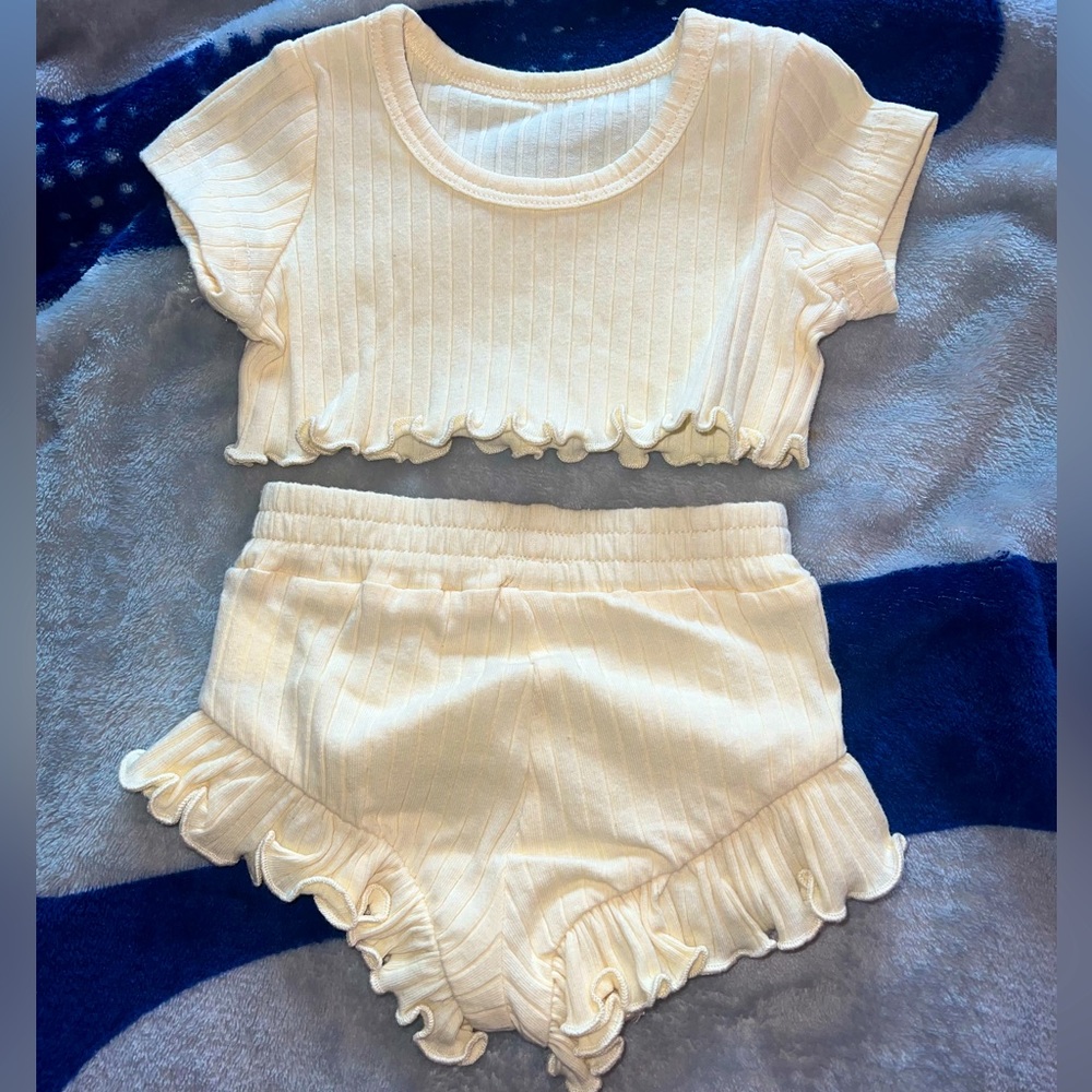 Top and bottom baby girl clothes.